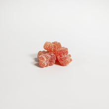 Stack of pink gummy bears on a white background with 'suplifull' branding.