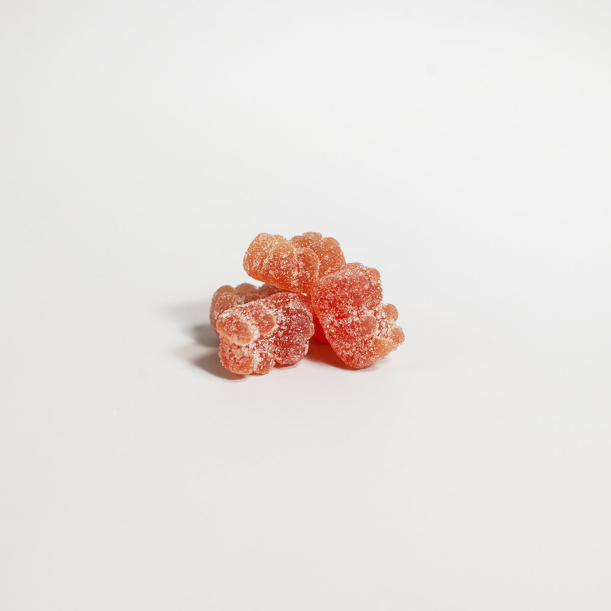 Stack of pink gummy bears on a white background with 'suplifull' branding.